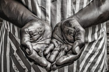 An image of a working hands of a father